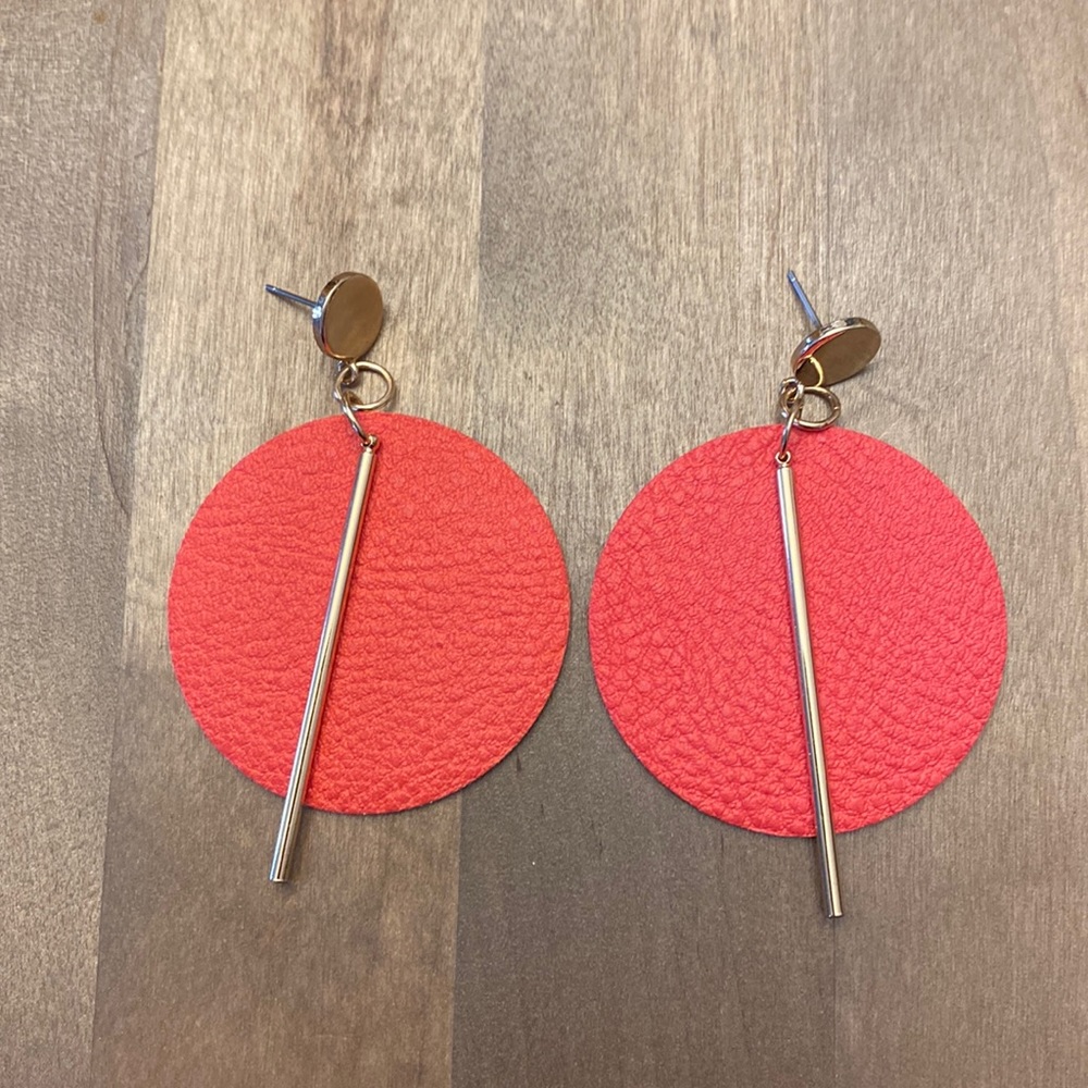 New never worn faux leather orangish red dangle post earrings.